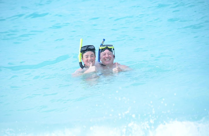 Seventh grader Ryan Bauman and his father snorkel in Florida