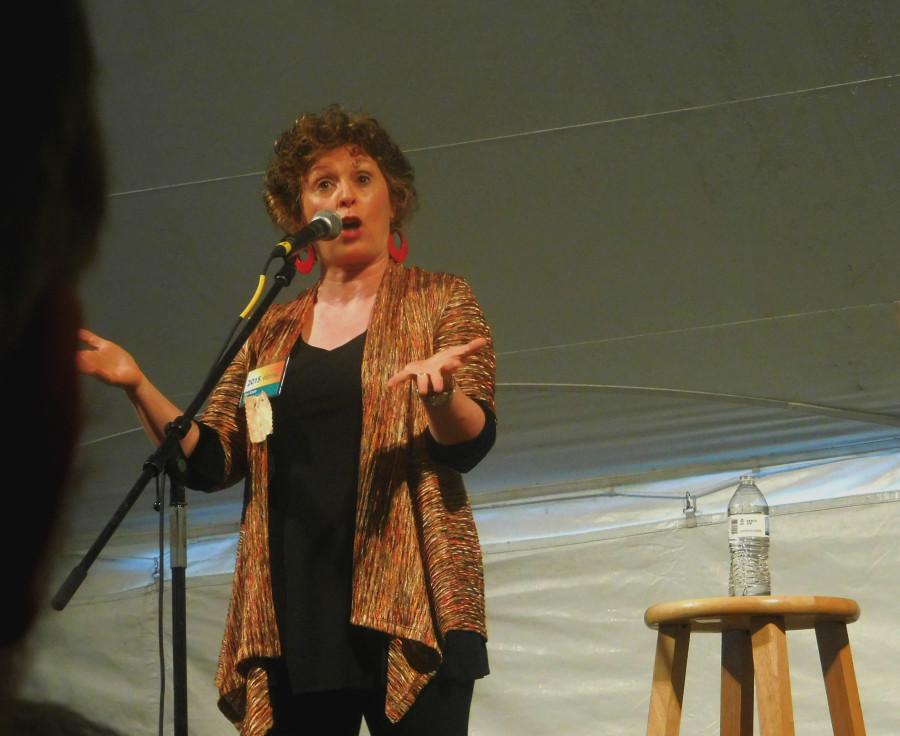 Storyteller Noa Baum performing for an audience.