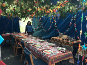“Sukkot has always been over the top for my family. Every year we would have a kind of block party to decorate our sukkah and every year it just gets more and more sparkly. We even had to expand it to fit all of the lights that we had.” ~ Manny Ozur-Bass, Senior