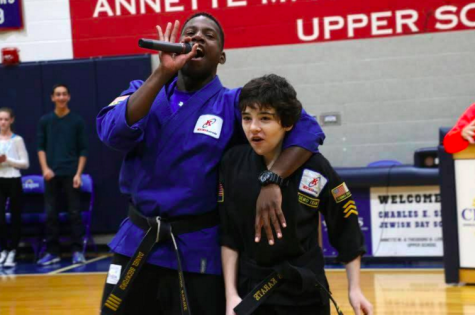 Pizer and his lifelong coach get the crowd pumped up at Kabbalat Shabbat.