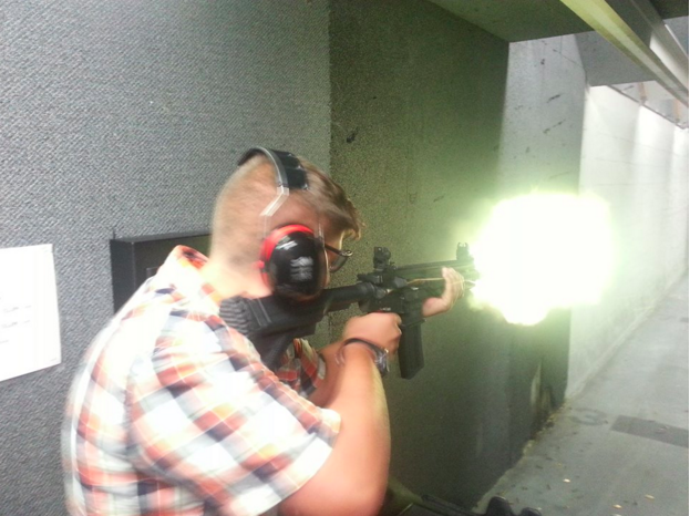 Firestone firing an HK 416, an assault rifle.