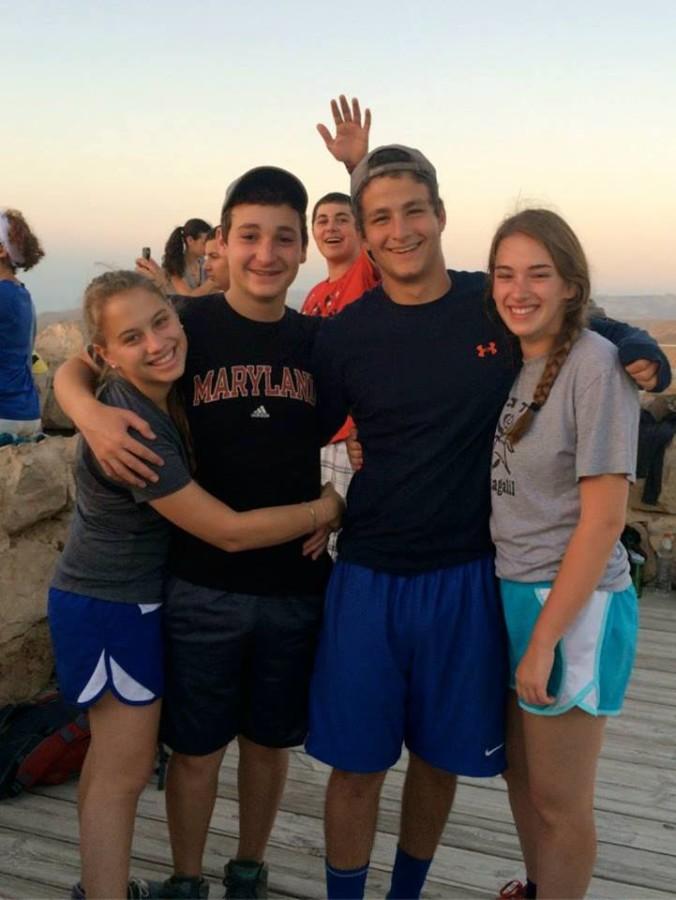 From left: Alumna Allie Weiner (15), Ezra Schwartz, Ben Neumann, and alumna Hannah Wexler (15) atop Masada during a summer trip to Israel in 2014. 