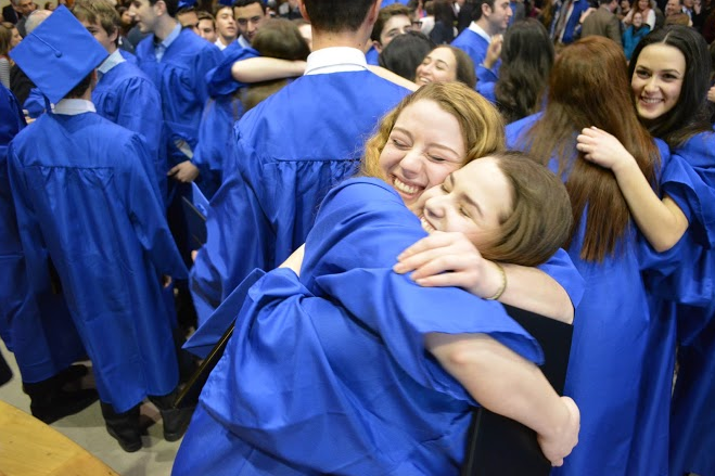 Seniors Eliana Katz (left) and Hannah Nechin (right) embrace at the conclusion of the ceremony. 
