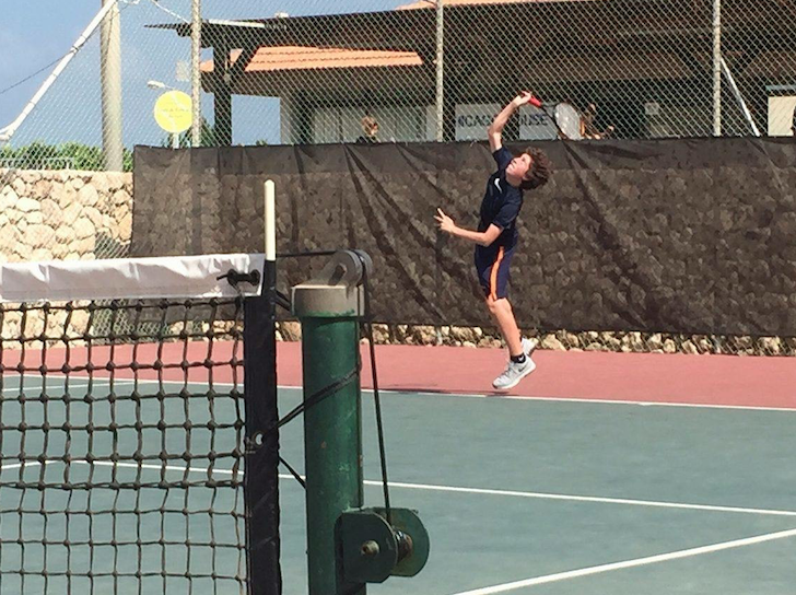 Freshman Seth Eisenstein plays tennis at the Israeli Tennis Center in Haifa on a trip to Israel with his synagogue.