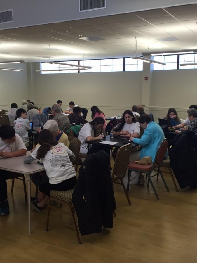 One group of JDS students help senior citizens with technology during Families and Action Day.