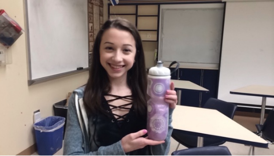 Freshman Eliana Gropman holds her water bottle that she carries around all day at school. 