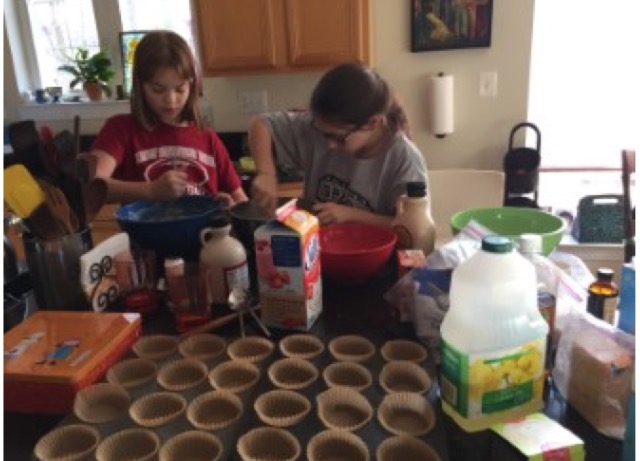 Shoshana Greenblum (right) and Dalia Siegel (left) work together to bake a batch of their cupcakes.