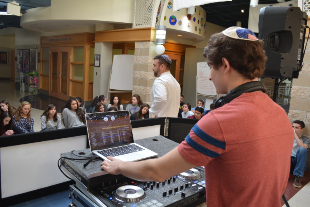 Senior Elan Arnowitz plays country music using his DJ equipment for Blank and Rosenthal’s students to celebrate Daniel Pearl World Music Day.
