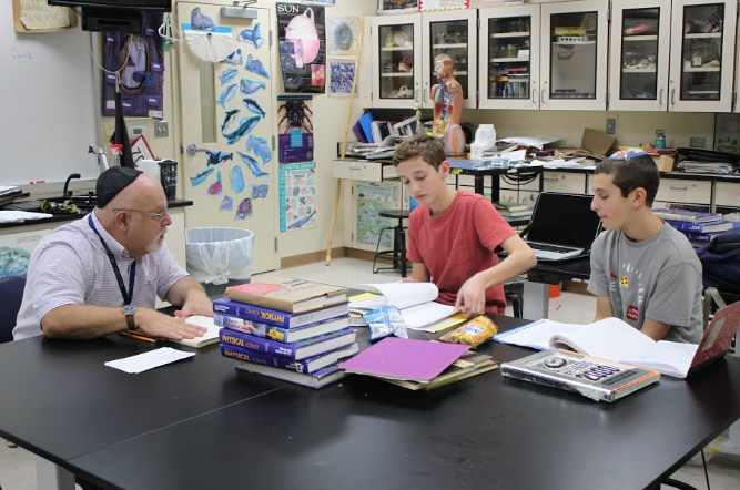 Science teacher Nick Miller teaches freshmen Jonah Abrams and Austin Kaminow a lesson during Greek club on Nov. 9, 2016. Abrams and Kaminow were the only two students present for the session, which covered the use of the Aorist tense.