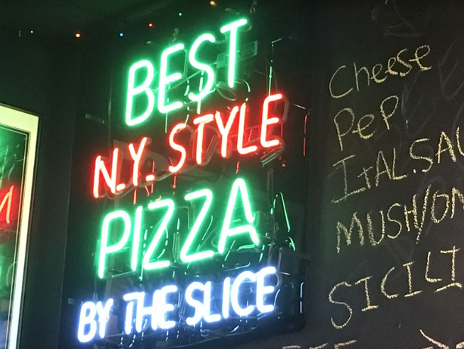 A neon sign hanging in the restaurant