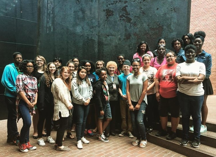 Sophomore Shira Godin (first row, far left) and other students from the Bringing the Lessons Home program with Holocaust survivor Nesse Godin (center).