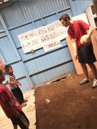 Junior Ben Shrock interacts with children in Costa Rica during his community service trip. 
