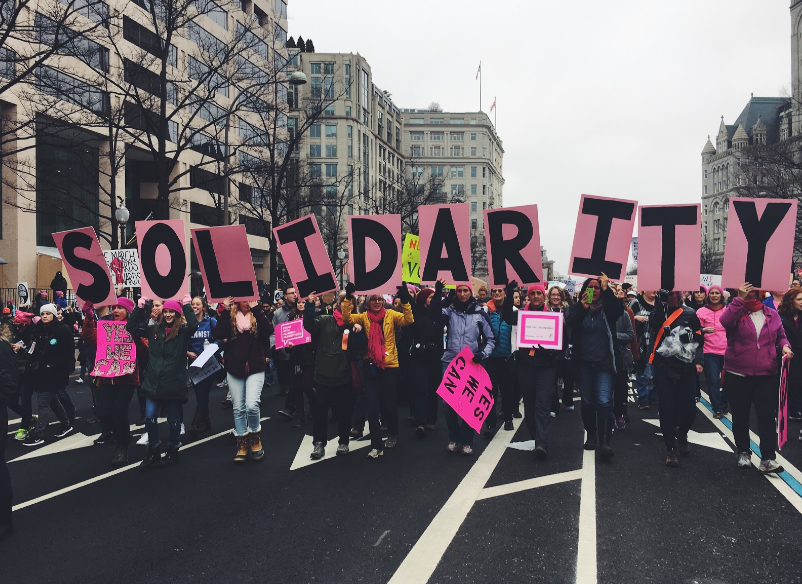 Women+stand+together+at+the+Women%E2%80%99s+March+on+Washington%2C+D.C.+Hundreds+of+thousands+of+other+people+in+the+crowds+had+signs+similar+to+this+one%2C+standing+up+for+their+beliefs.