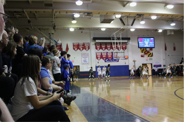 CESJDS fans watch nervously as the Lions pull ahead by one point during the third quarter. The game was neck and neck throughout most of the second half, before they took the lead for good at the end of the fourth quarter.