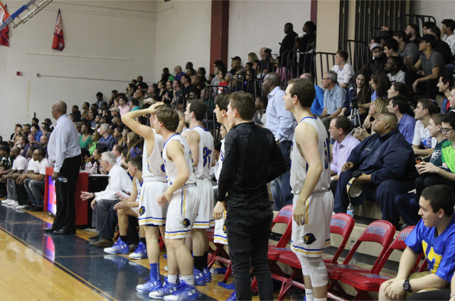 Coach Dave McCloud (left, standing) and the Lions bench watch the tight fourth quarter. JDS and Sandy Spring were the two best teams throughout the year in the PVAC and the last meeting between the teams was heated and physical.