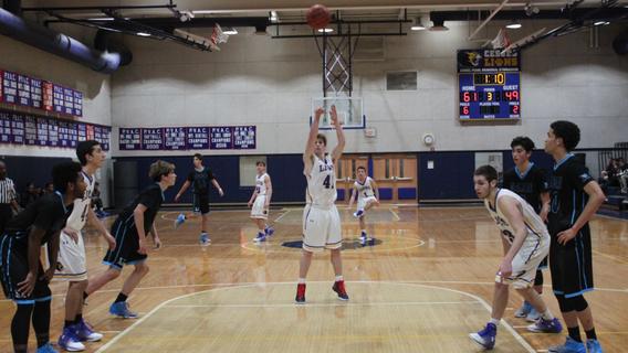 Senior Bryan Knapp shoots a free throw during the third quarter of a game against the McLean Mustangs. The Lions went on to win the 82 to 70. 