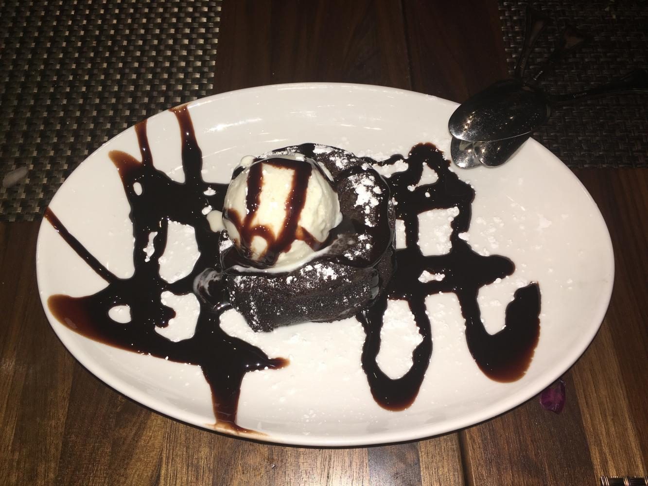 The Chocolate Lava Cake is served with ice cream and covered in fudge sauce. Although it has an enticing appearance, the dish is not the meals highlight. 