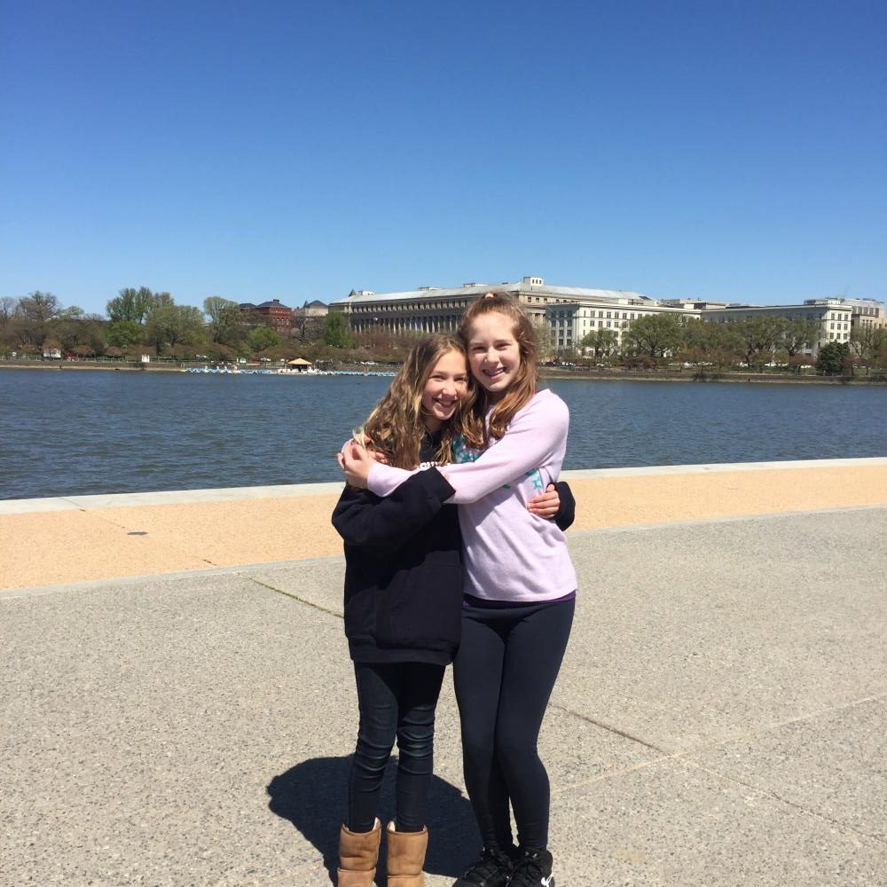 Senesh Magill (left) and her friend eighth-grader Zoe Wertlieb (right) stand on the National Mall. Magill was always happy with her friends.