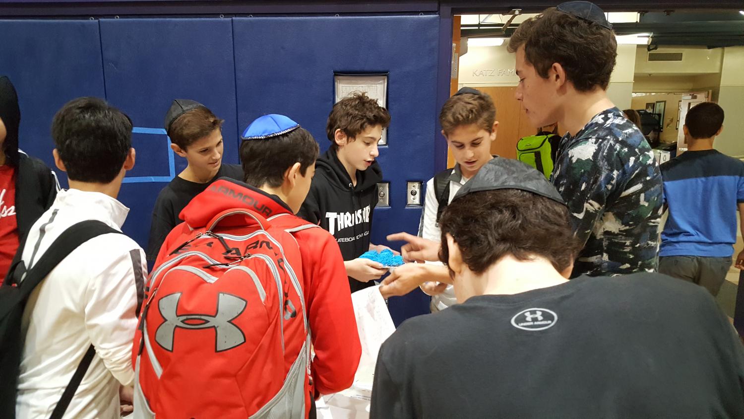 Freshmen Oren Minsk and Nate Miller recruit members of the Progressives Club. The crowd around the table was unexpected, but common at the well-attended club fair.