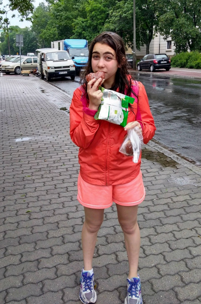Junior+Selah+Bickel+takes+a+bite+out+of+the+only+kosher+paczki%2C+Polish+jelly+doughnut%2C+that+she+could+find+in+Poland.+She+also+holds+her+favorite+apple+chips.