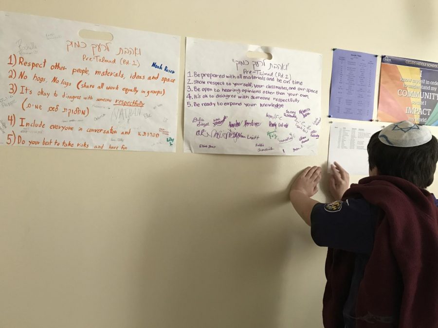 One middle school student works on determining how the phrase “VAhavta LeReiakha KamoKha” can translate into everyday school situations. The session explored the implications of loving one’s neighbor as one loves oneself.
