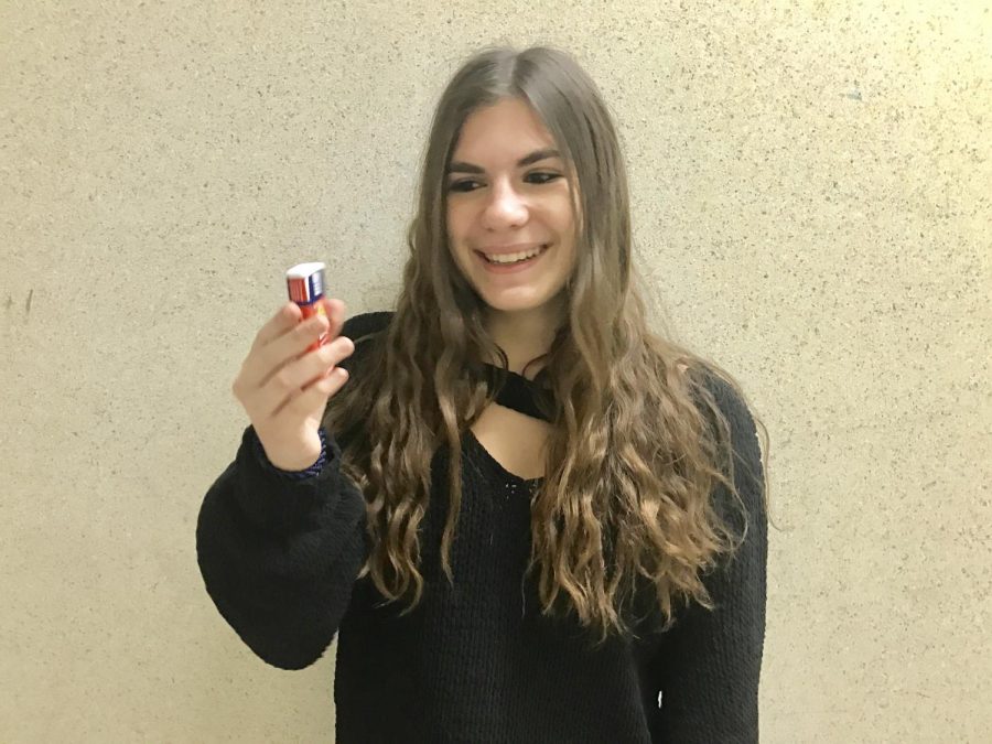 Freshman Sami Himmelfarb holds her Auvi-Q injector. Unlike an EpiPen, the Auvi-Q includes an automated voice to walk the individual through the lifesaving procedure. 
