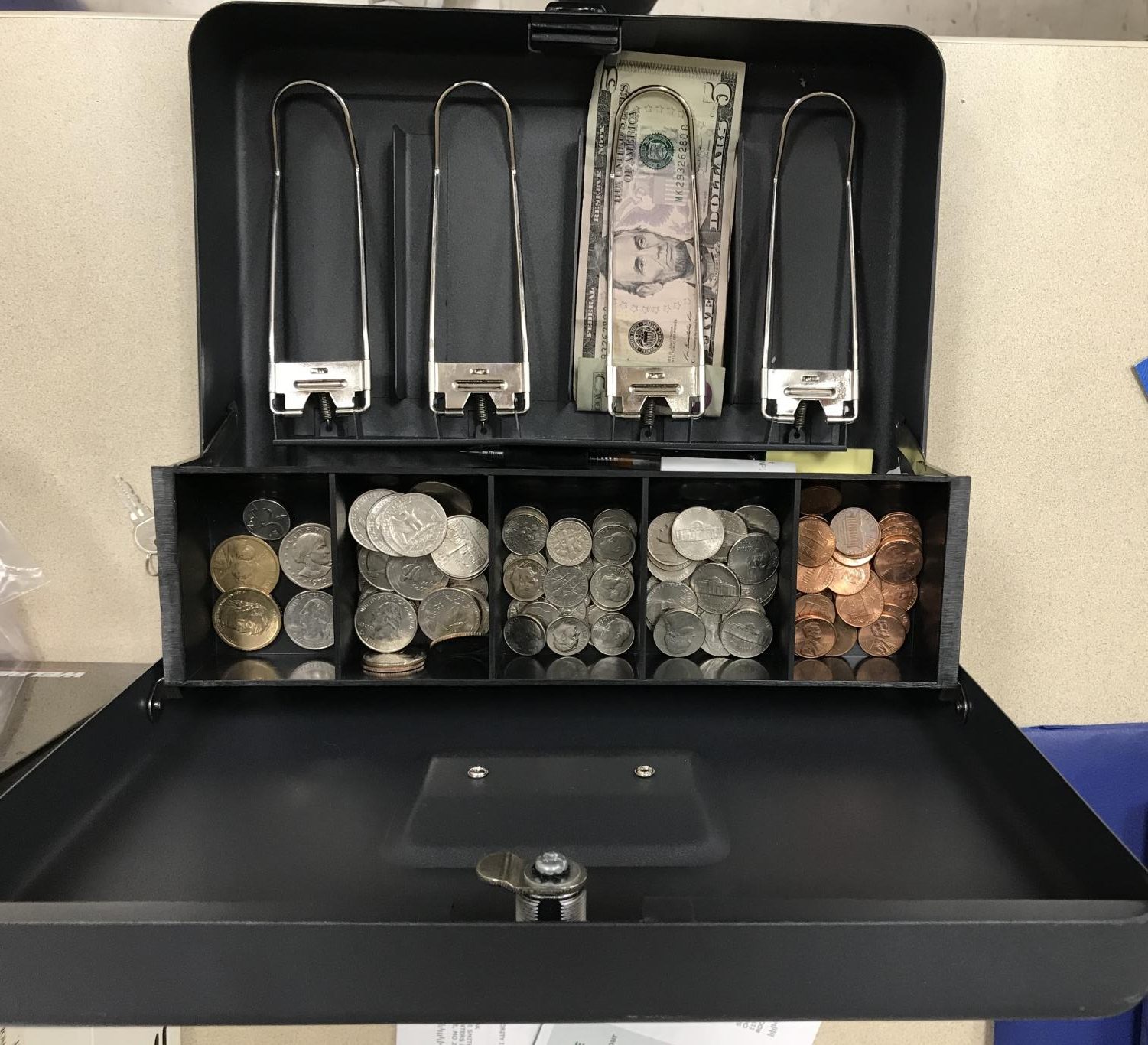 A grade government lockbox displays the class's funds collected from the fundraiser. This money can be spent on class activities and prom.