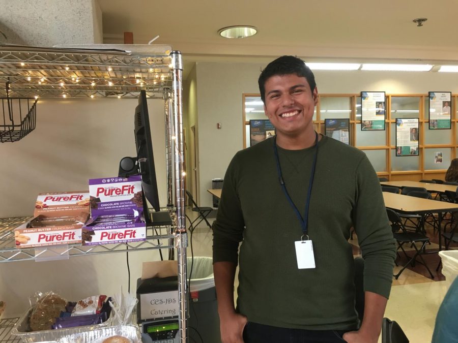Erik Nieto stands next to the transportable food kiosk. During lunch, everyday, Nieto is stationed in the middle of the Cardo, and provides grab-and-go food options for student’s pleasure.
