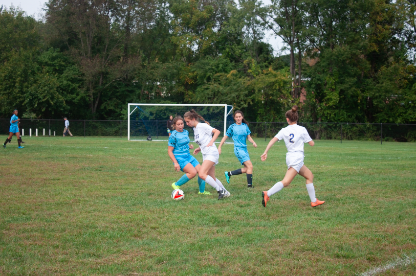 Girls varsity soccer:

Sophomore Ally Knapp dribbles the ball past her McClean defender. The girls varsity soccer team won the game and have a record of 6-3.