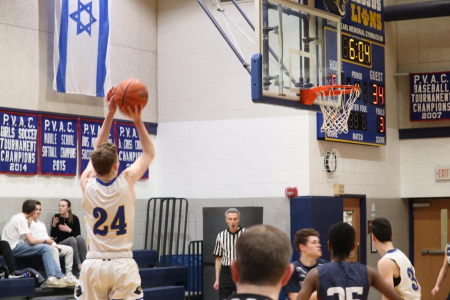 Senior and captain Zev Katz shoots a three-pointer   in the second half. Katz totaled 19 points in the game.