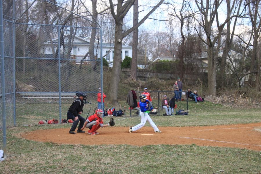 Junior third baseman Austin Kaminow hits a single in the Lions victory over Waldorf.