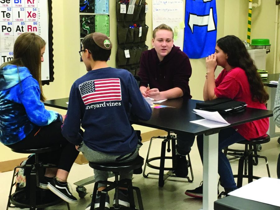 Eighth-graders discuss solutions in the new Cadena Initiative elective. In the class, students design prototypes to be used in natural disasters and compete with other schools in the region for a chance for their designs to be implemented in real-world scenarios. 