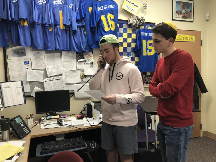 Junior Ryan Bauman and sophomore Alex Landy address the school over the PA system to commemorate the victims of the Parkland shooting and recent gun violence in America.