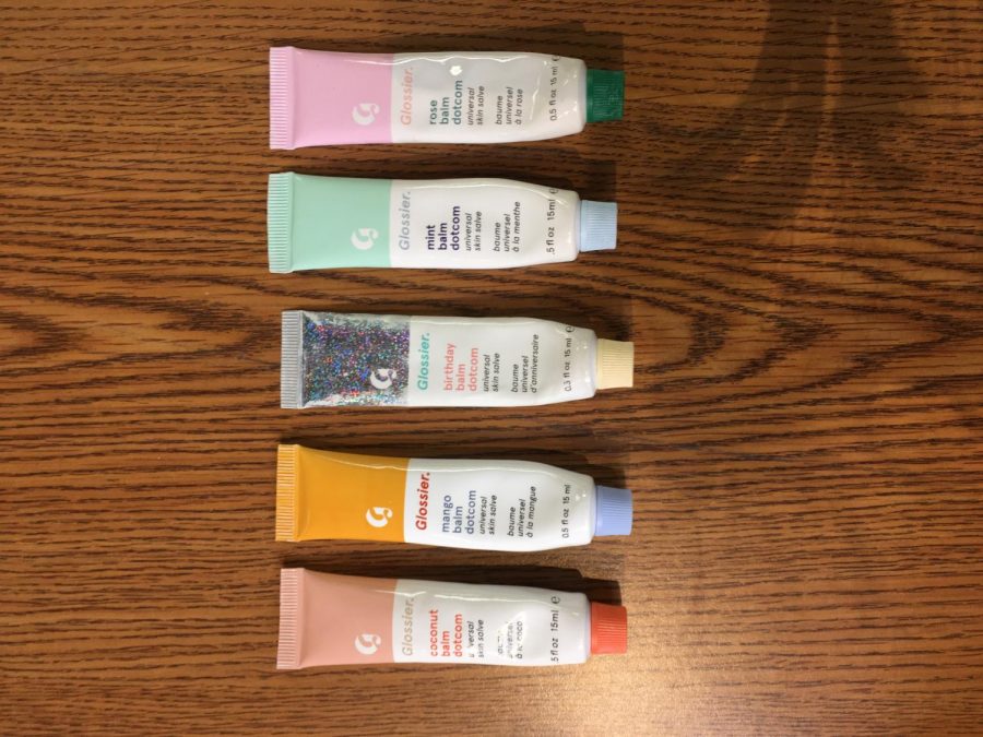 Glossiers bomb dot com lip balm comes in seven flavors. Most flavors have their own scent and tint, although some have neither.