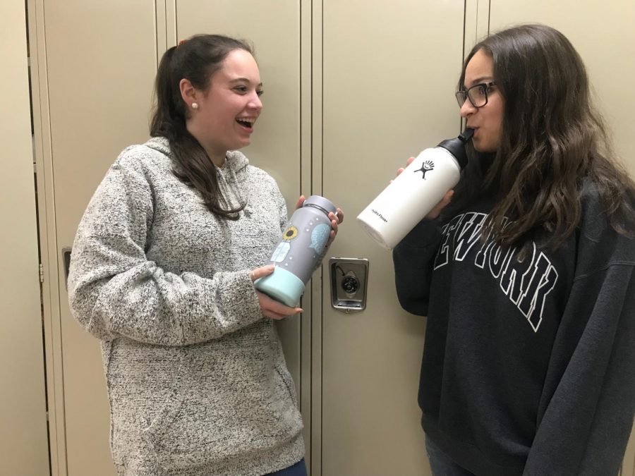 Seniors Leah Simon and Naomi Jaray use their Hydroflask bottles, the most recent water bottle trend.