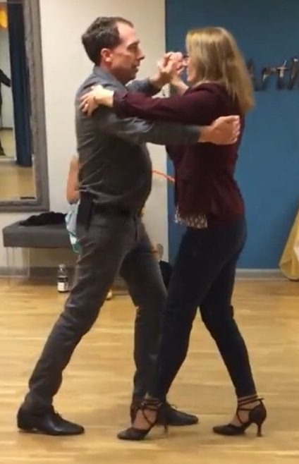 Dr. Warden and his wife do the tango in their ballroom dancing routine.