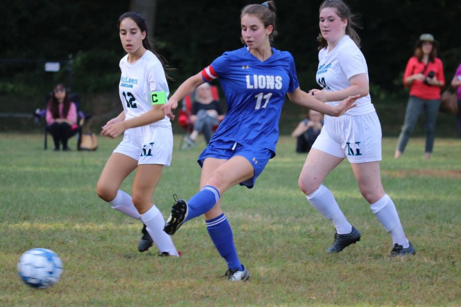 Senior and co-captain Ally Knapp passes the ball to a teammate in the Lions 7-1 loss to the Field Falcons on Thursday. 