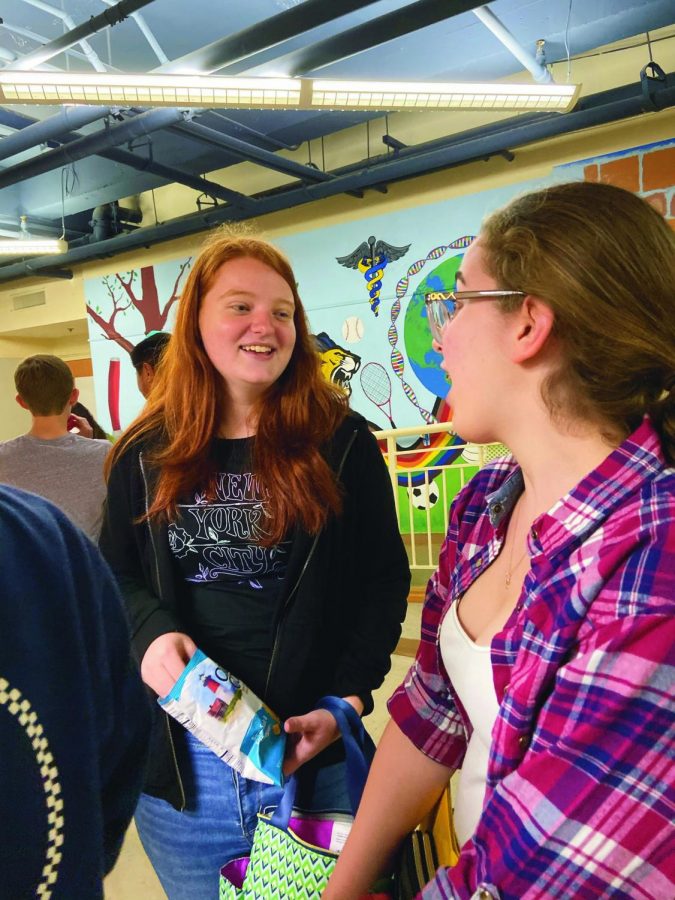 Junior Alex Ruf talks with one of her new friends during lunch.