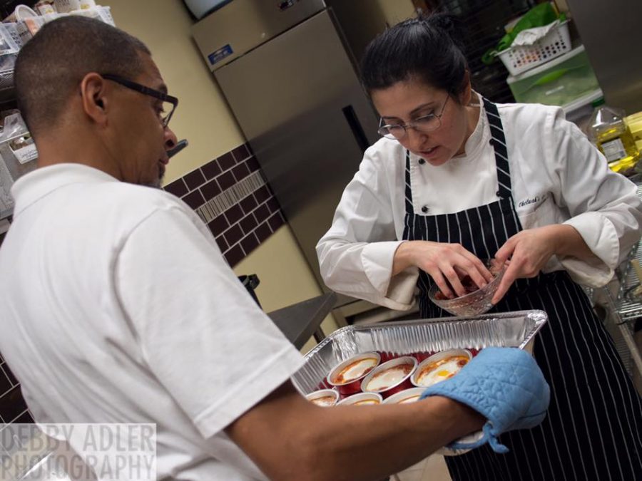 Rachel Bitton prepares food in a kitchen, her natural workplace. 