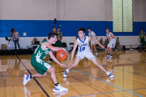 New transfer scores spot on basketball team