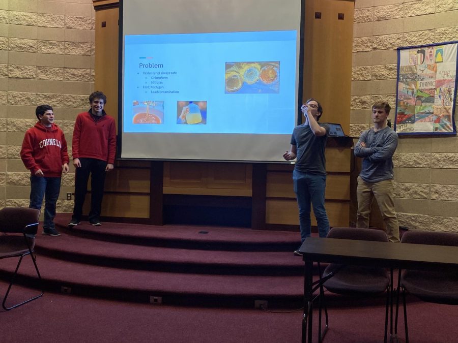 Students present the prompt facing contestants in the second annual hackathon hosted by CESJDS, which was to help people manage and maintain their health. 