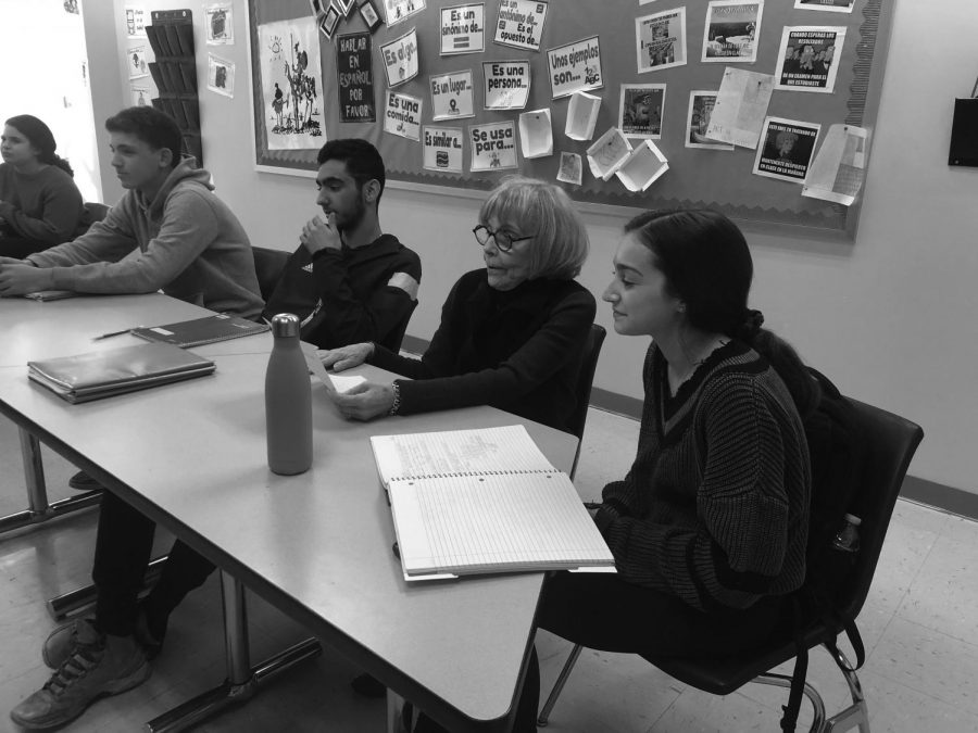 Dean of Students Roslyn Landy sits in on a senior math class and observes the learning experience. In addition to shadowing students, administrators regularly sit in on classes to evaluate teachers.