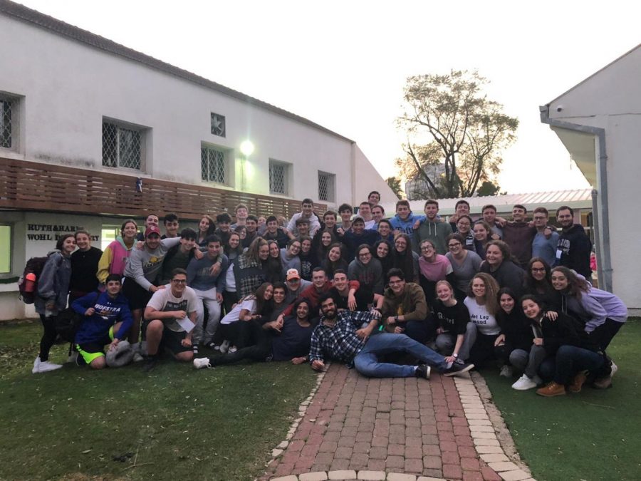 Members of the Class of 2020 pose for a final photo in the late afternoon before leaving for the U.S. Many of them were up since 2 a.m. to cherish their final day together.