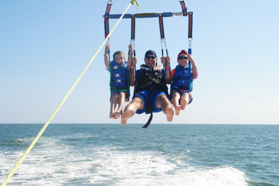 Learning+specialist+Brett+Kugler+and+his+family+parasailing.+