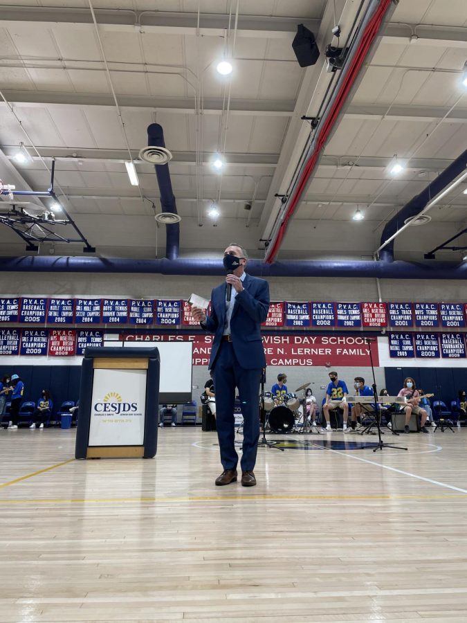 Head of School Rabbi Mitchel Malkus gives a speech to high-school students during the first multi-grade assembly since the pandemic began. There were multiple speakers, and Shir Madness performed as well. 