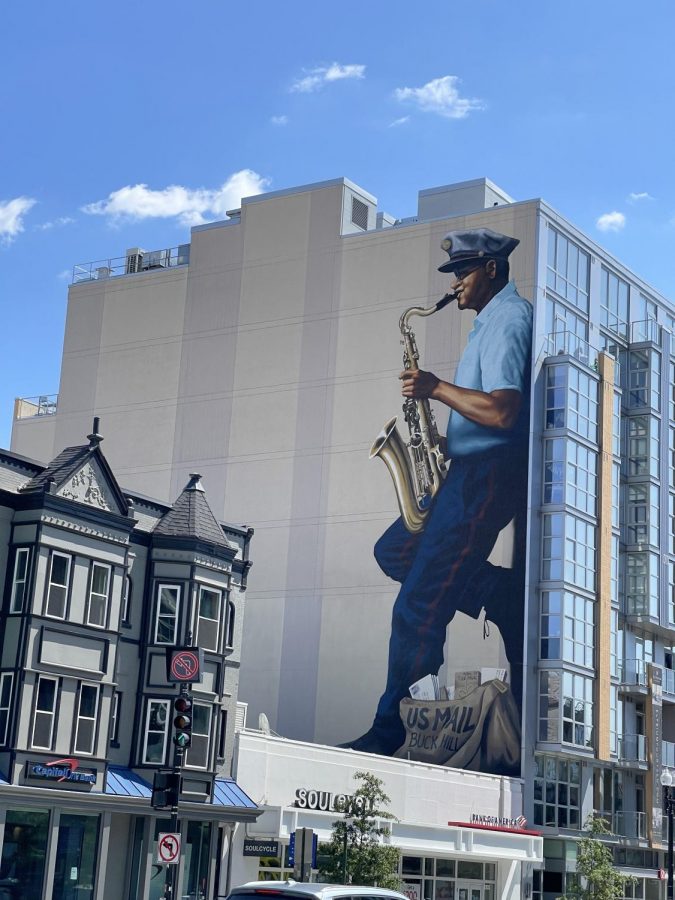 A U-Street mural depicting musician and mailman Buck Hill. 