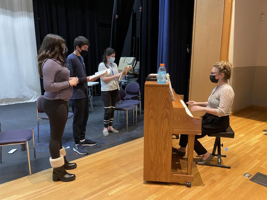 Music teacher Sherry Benedek helps students rehearse for the Joan and Marvin Rosenberg High School Musical 1776.