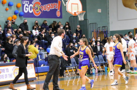 Cohen high-fives Friedman as she walks off the court during a timeout. This was the seniors’ final regular season game against Berman. 