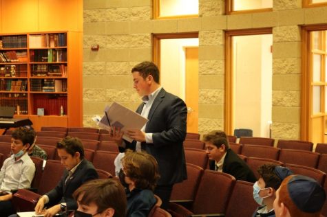 Eighth grader David Satloff presents an amendment to his fellow representatives.