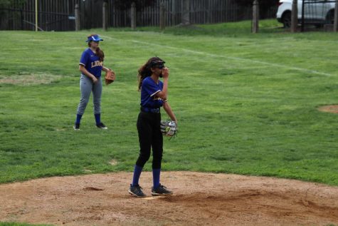 Eighth grader Mia Forseter gets ready to pitch in the semifinals against the McLean Mustangs. The Lions won this game by a score of 16-6. 